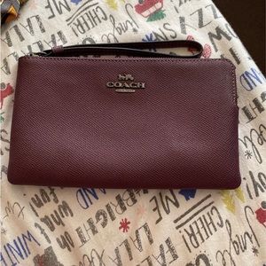 Coach large wristlet in boysenberry